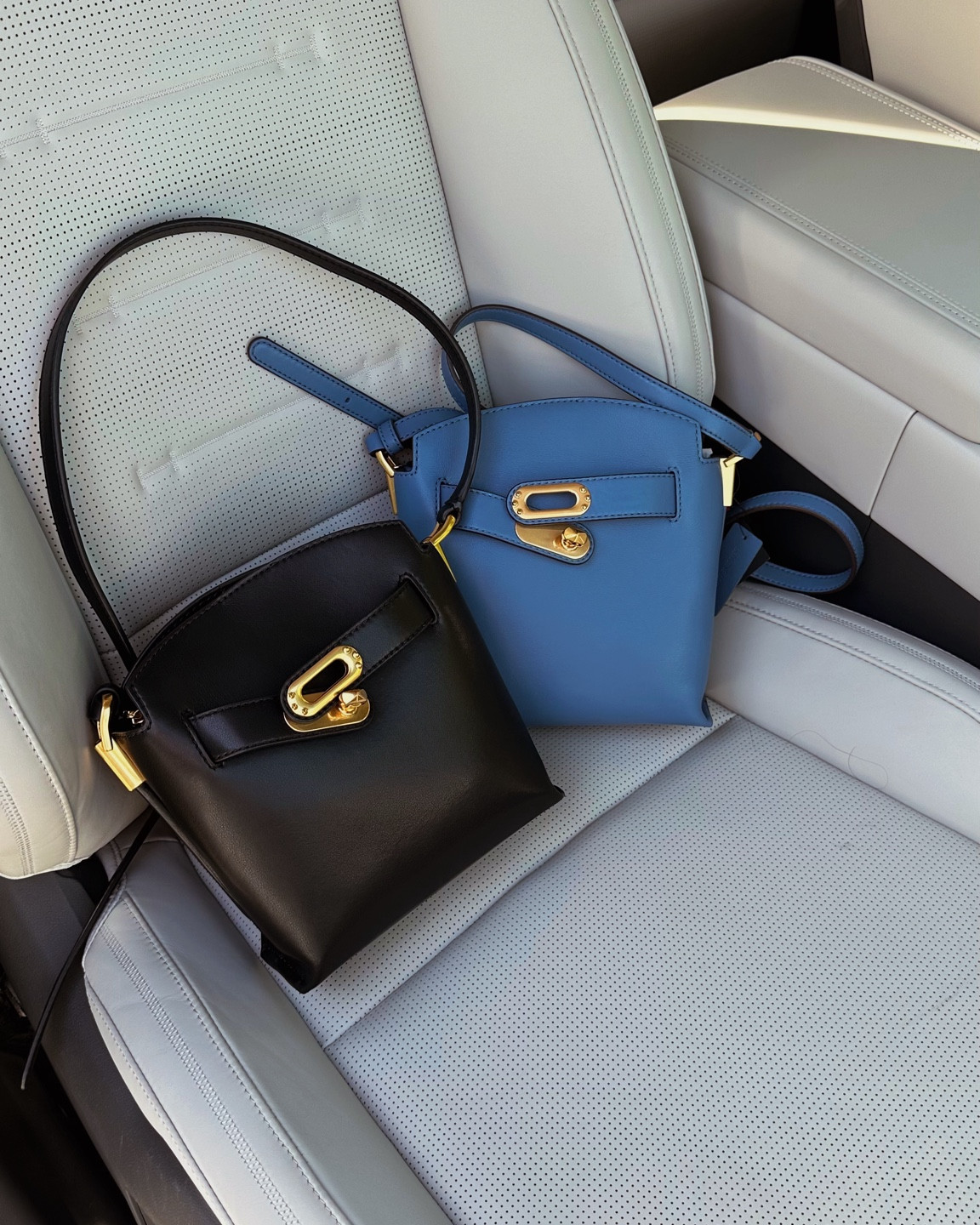 What do you think? Black or blue? It also comes in white and grey —— very well-made bag for under $200. 

#LTKItBag