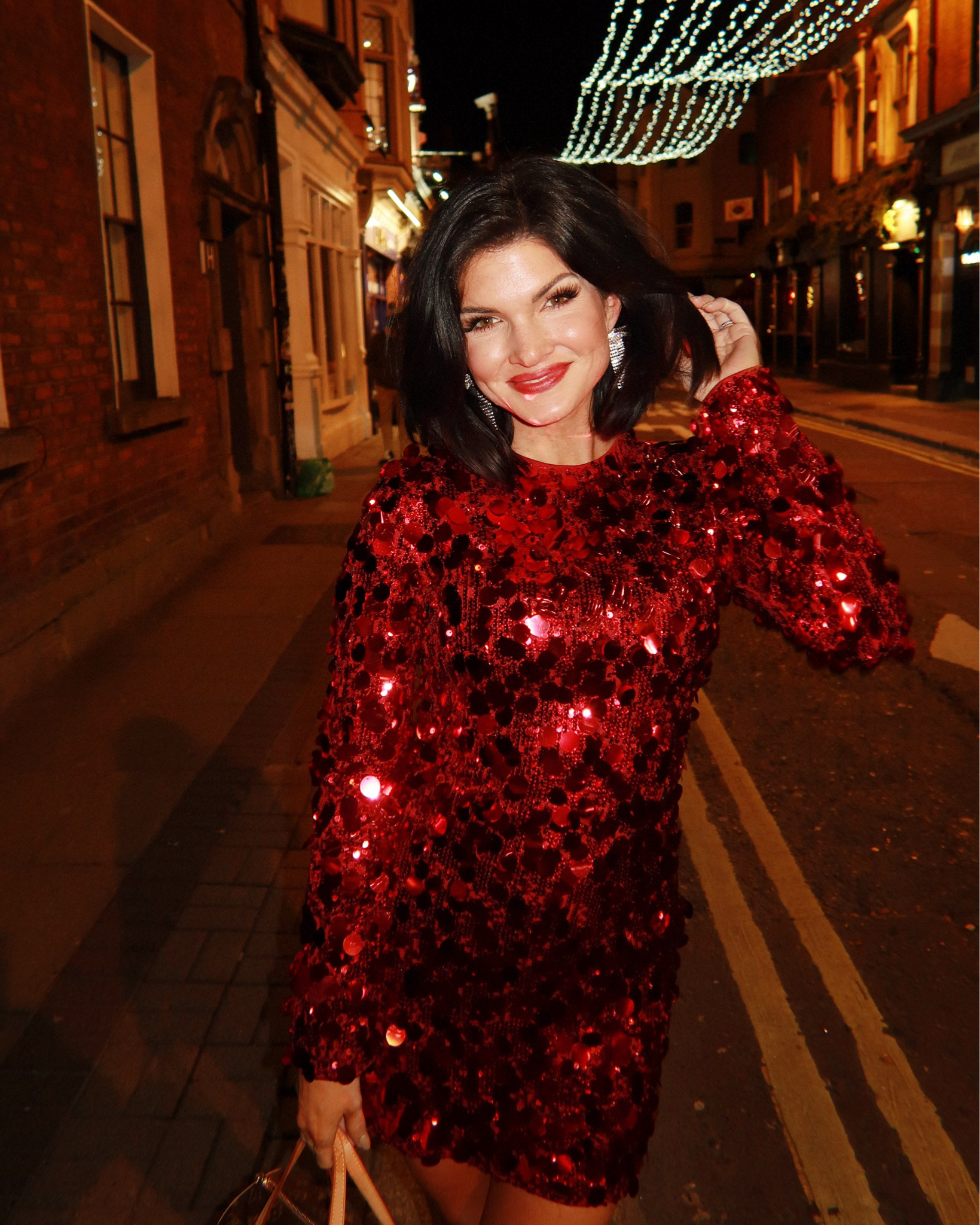 Red sequin holiday dress with silver kitten heels and statement bow earrings 

#LTKParties #LTKHoliday #LTKStyleTip