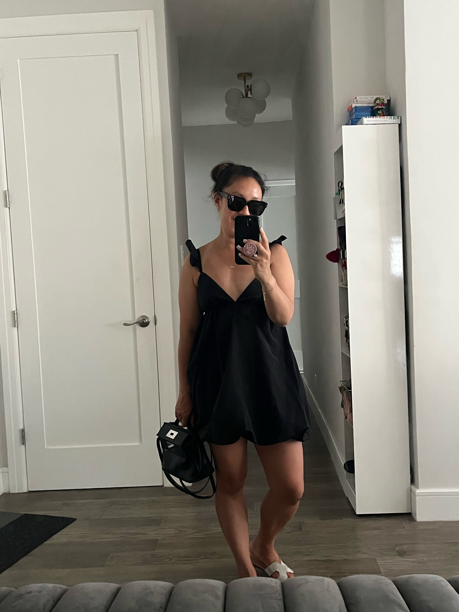 Little black dress. Bubble hem dress. This dress feels short, but my legs look loooong. It’s worth it, right? I’m wearing an xxs. The straps are adjustable and there’s a cute criss cross back detail you can tie.

#LTKItBag #LTKShoeCrush #LTKTravel
