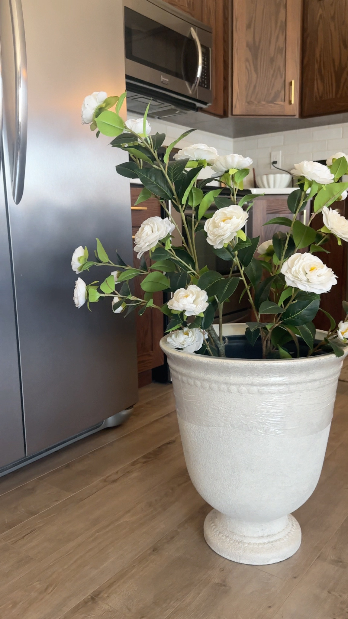 Artificial Camellia Trees and urn style planter from Walmart! Low maintenance front porch decor for the summer 

#LTKHome #LTKSeasonal