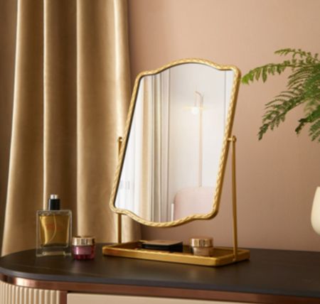 Gorgeous gold mirror for dresser or vanity. Has a tray for keeping jewelry or maybe lipstick  