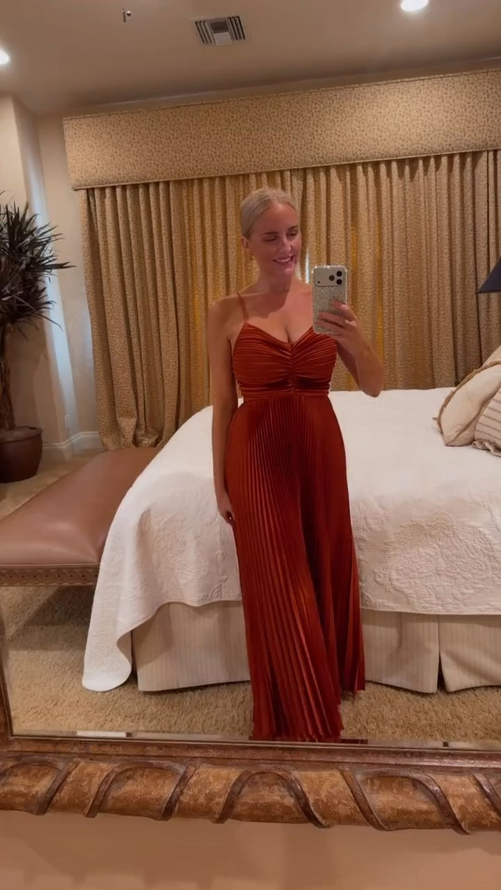 This beautiful rust satin pleated maxi dress is perfect for a fall wedding guest dress.