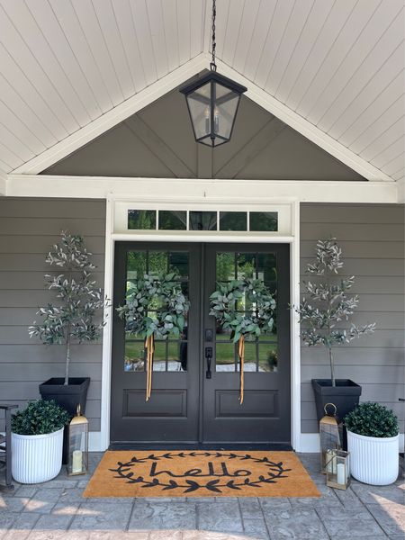 Front porch inspiration using faux trees and wreaths 

Mat, faux Box woods, faux olive trees

#LTKSeasonal #LTKhome #LTKstyletip