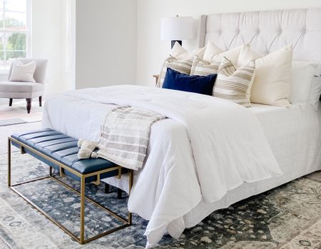 Using a bench at the end of your bed is a great way to anchor the space and also add functional seating!
.
.
.
Bedroom Design
Navy and Gold Leather Bench
White Bedding
Tufted Linen Headboard 
Navy Blue Accents


#LTKhome #LTKstyletip #LTKbeauty