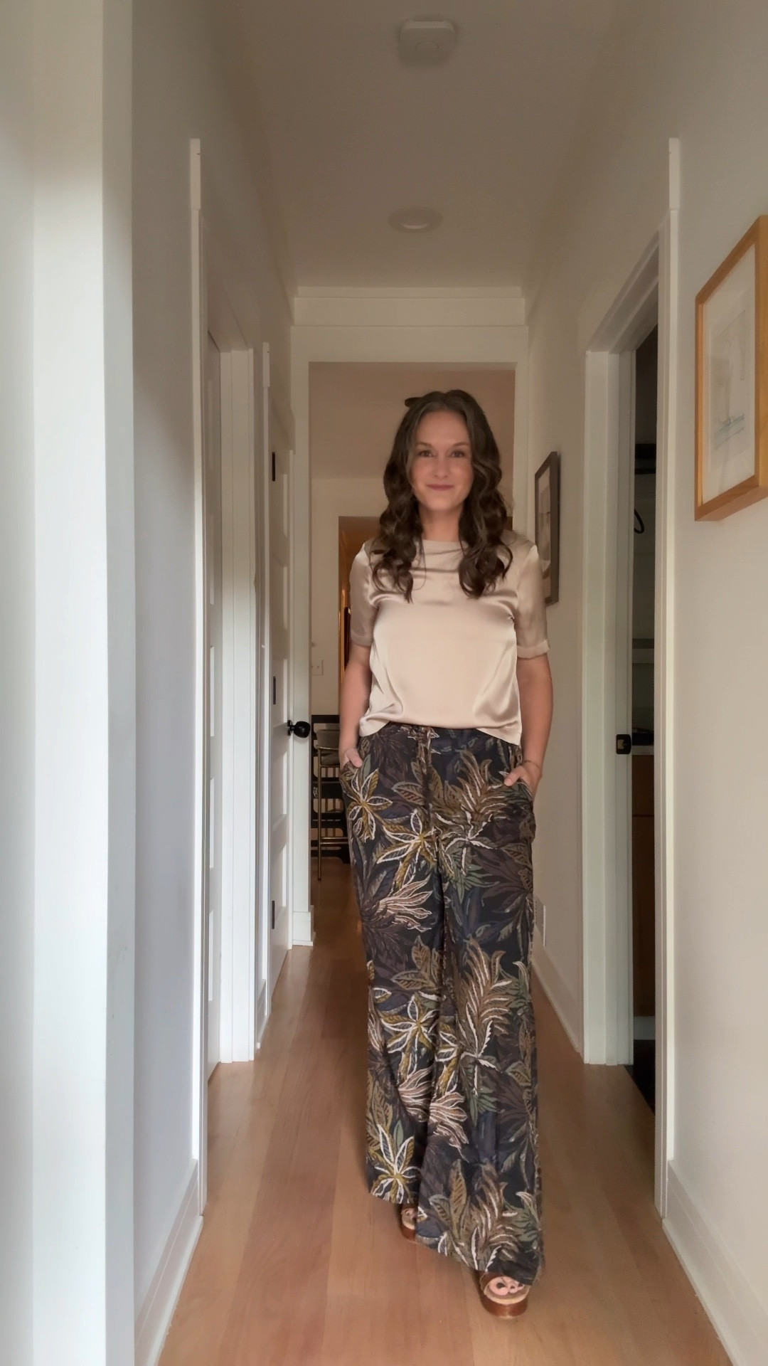 It’s a lively Tuesday in August, and the city mom is turning heads in Isla Palm printed pants paired with a flowing natural satin top, brown flatform sandals keeping her comfortably chic, and her go-to gold hoops and signature herringbone necklace adding just the right shine. Her new stack of permanent bracelets jingles softly as she moves through a day that’s part whirlwind, part triumph: daycare drop-off, prepping for a meeting with a debut author about an upcoming book launch (stay tuned, it’s going to be good!), a quick pit stop at physical therapy, and an afternoon spent pitching book publicists on The Chicago Literary Salon—she’s already lining up some amazing authors. By evening, she’s dressed and ready for the crown jewel of the day: facilitating the Friend of a Mom Book Club featuring Sonali Dev’s *There’s Something About Mira*, where laughter, literary magic, and a little bit of city-mom glamour collide.

#LTKWorkwear #LTKSeasonal #LTKStyleTip