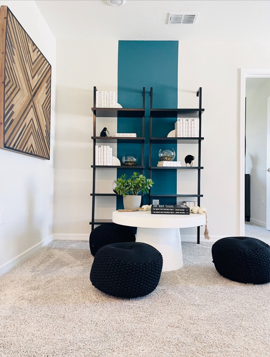 Looking to create a multipurpose room?  Here is an easy idea for a reading nook or a space for children.  First step is to paint a green strip for the accent wall and add the seating area and add texture with wood wall art.  

#LTKhome #LTKkids #LTKstyletip