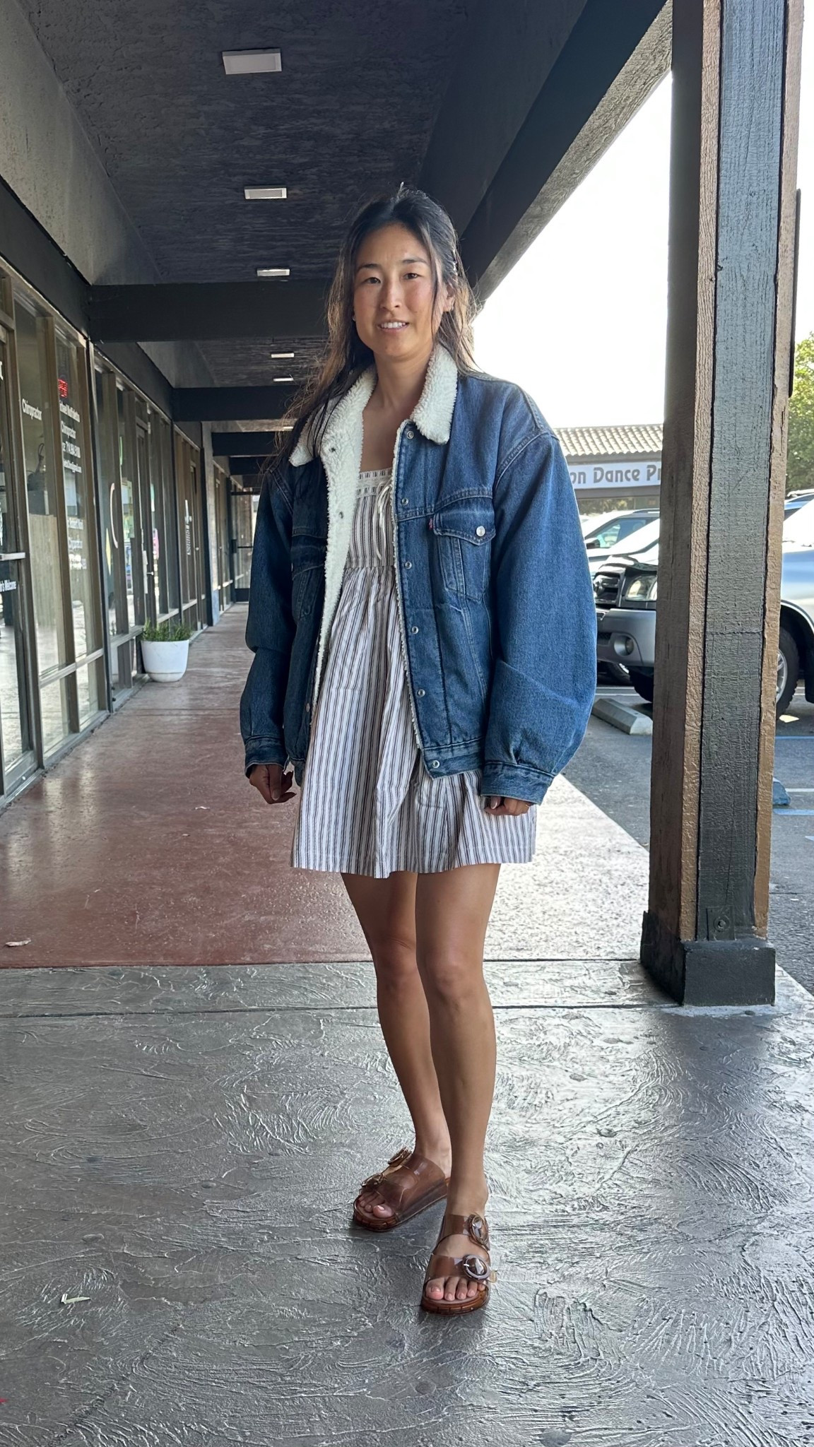 Photo credit to my son 😂 ok but all things serious this fit is one of my new faves because the minidress is actually a romper (dress goes all the way around and the shorts are built in like bloomers underneath. I went with the small because the body measurements. I did not want a front or back wedgie all day. I’m obsessed with the built in pockets and overall comfort with the linen cotton fabric. I paired this with my Sherpa lined Levi’s denim jacket and my current go-to sandals. Size S in the romper and size 6 in the sandals (they run large)

#LTKdayinmylife #LTKootd #LTKgrwm