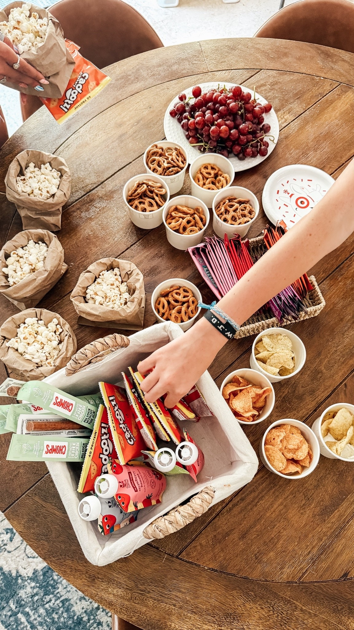 #TargetPartner half our movie night table is new finds, half is stuff my family would riot without. Chomps, Cadootz cheddar crackers, Kindling pretzels, and Little Spoon fruit puzzlers + fruit strips are new to us this week, courtesy of @Target — and they're already sitting next to our forever staples like popcorn and our go-to ranch dip. Justin scooping dip into the bottom of a cup and piling chips on top is the one new trick that's sticking around for good. Shop every piece of the table here.

#LTKmomlife #LTKfoodie #LTKSaleAlert