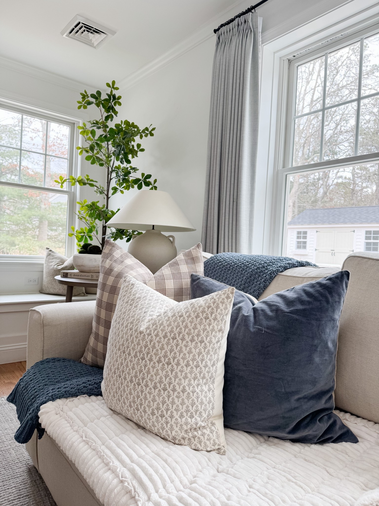 This cozy corner is a favorite spot during all seasons! 🤍 I’m shocked these throw pillows are still in stock. This faux olive tree from Amazon, which is affordable and looks so lifelike.

#LTKHome