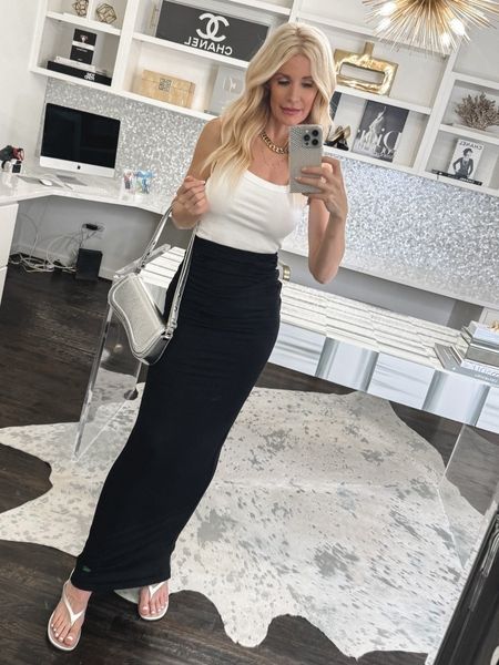 TREND ALERT 🚨 Maxi Skirts are one of the hottest summer trends of 2024 and this one is UNDER $70!PS. This cropped white tank is such a versatile staple that can be worn so many different ways.  I’m wearing an XS in the skirt and tank. 

#LTKOver40 #LTKFindsUnder50 #LTKSeasonal