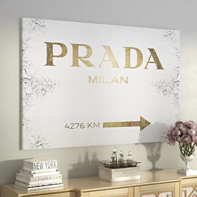 https://www.wayfair.com/decor-pillows/hd0/milan-sign-textual-art-on-wrapped-canvas-in-gold-l1318-k~w | Wayfair North America