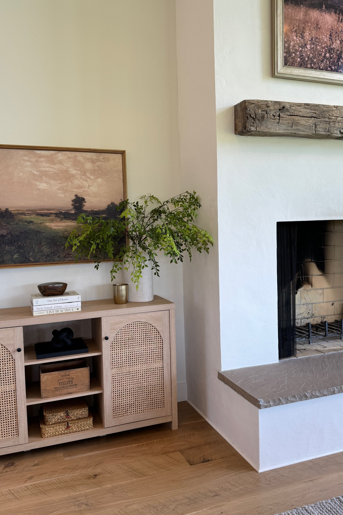 We love this styled console table next to our fireplace. It has been such a great addition!

Console table, accent table, sideboard, side table, vase with green stems, home decor books, lamp, organic modern lamp, styling baskets, black knot, plaster fireplace, rustic wood mantle, stone hearth, organic modern decor, European modern home

#LTKHome