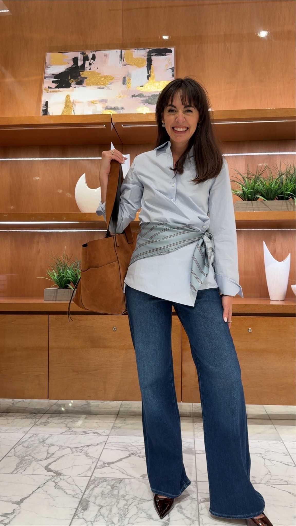 This scarf gives this outfit some extra flare! ✨ Whole outfit is on sale during the Nordstrom Anniversary. The blue wrap button down pairs perfect with this denim. Love the extra touch from the scarf and suede bag!

#LTKootd #LTKSeasonal #LTKSaleAlert