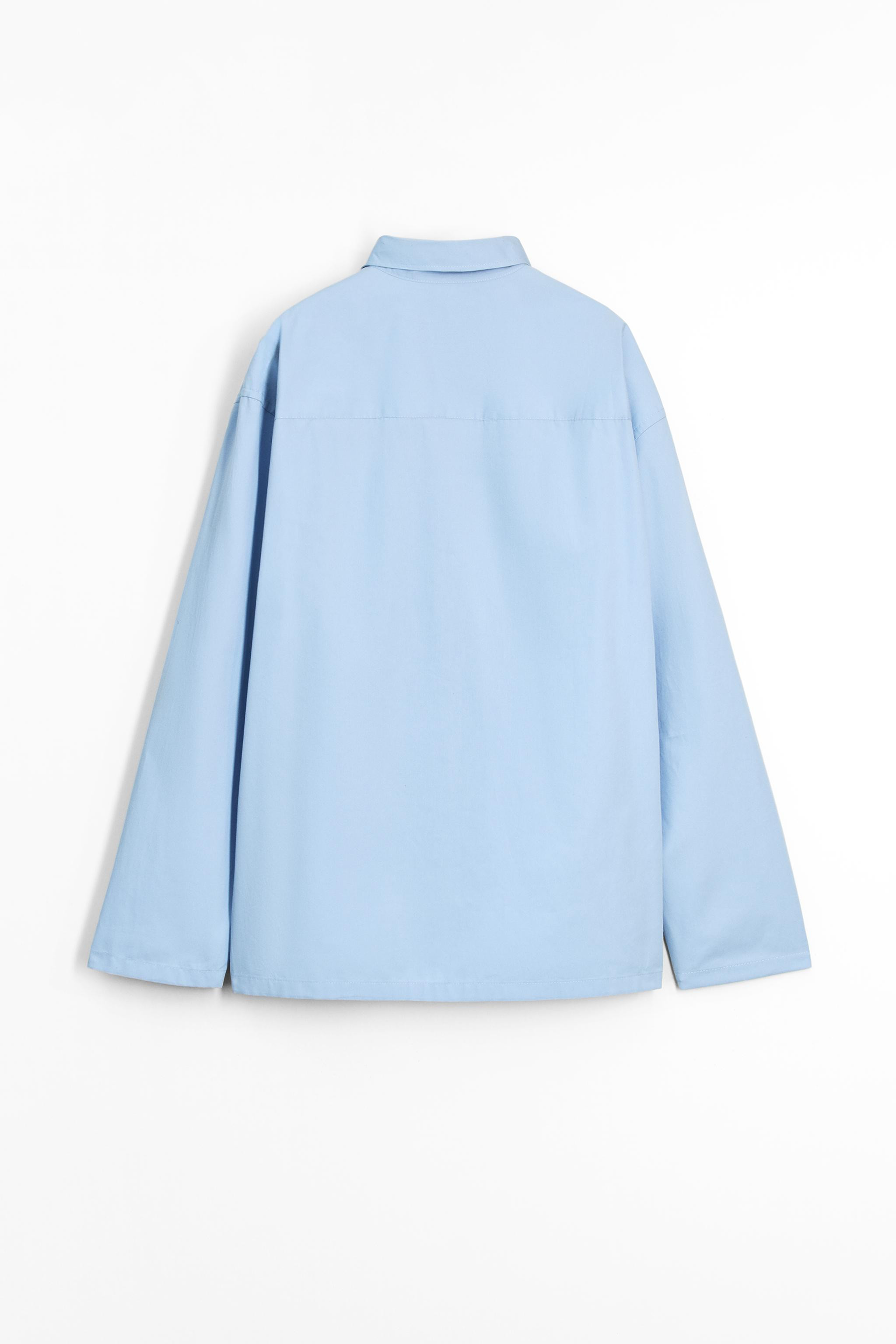 Relaxed fit shirt made of cotton fabric. Spread collar and long sleeves with pleat detailing, fin... | Zara US