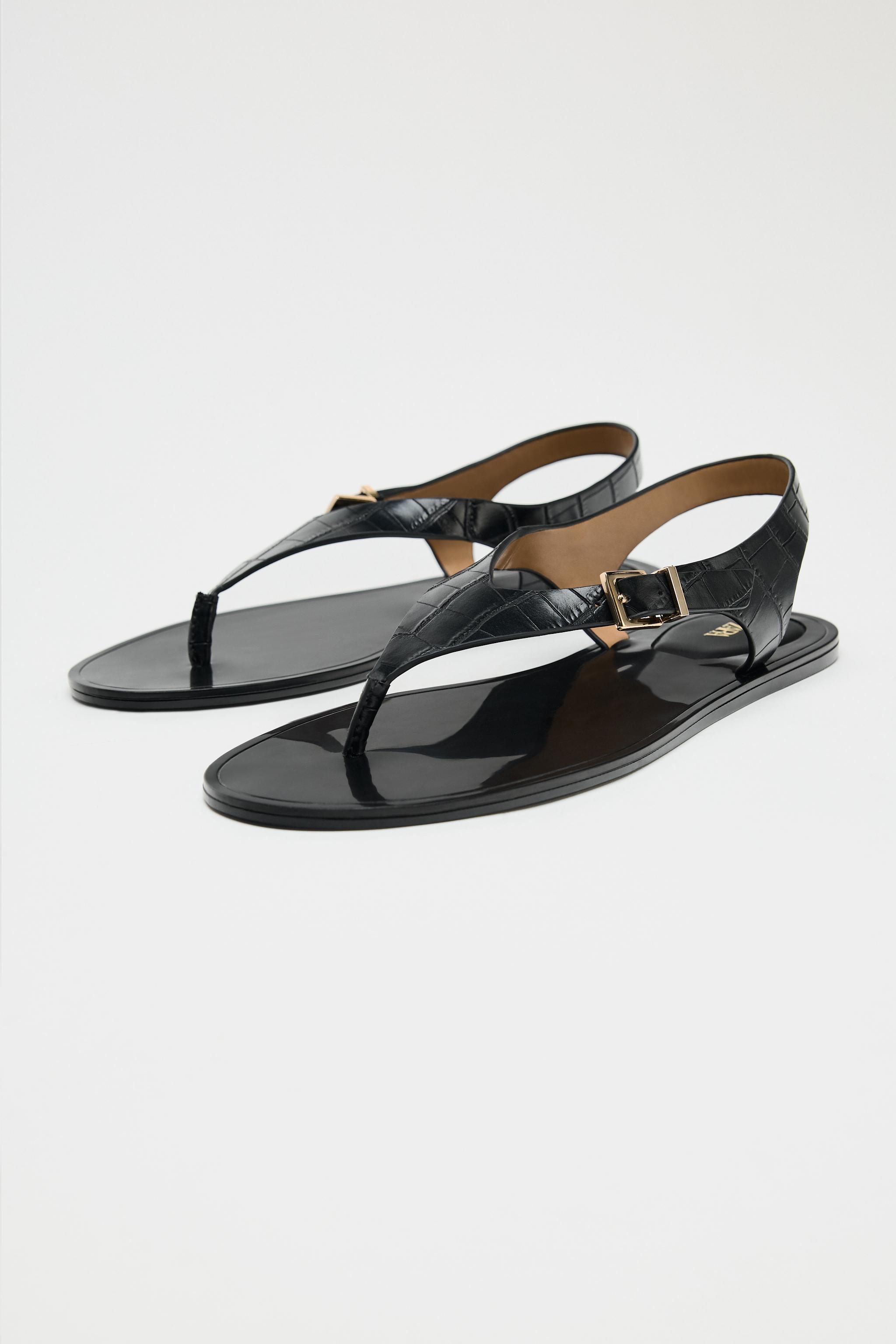 Flat sandals with embossed upper. Toe loop. Adjustable metal buckle closure on back strap. Rounde... | Zara US
