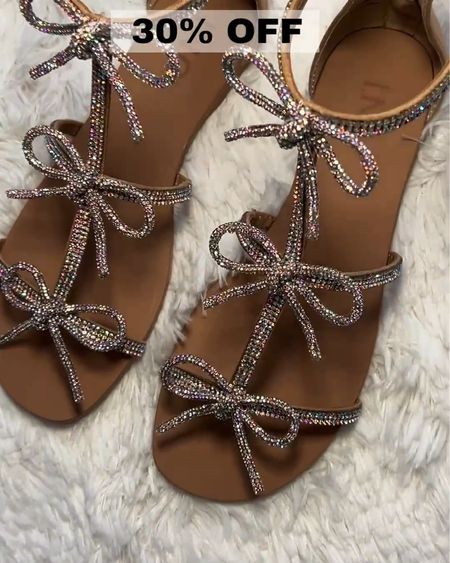 Add a little Sparkle to your step with these Rhinestone trimmed flat Sandals all tied up in a sparkling bow --

MACY’S is having a SUPER SALE on shoes at 30% OFF my Friend!!!! 🎉
These super comfy Sandals are on SALE for 30% OFF and glisten in the bright sun ☀️ 

I just bought 4 new pairs all shown below - Just click to see them!!!
Spring Outfit - Work Outfit - Vacation- Boots - Sale Alert - Under50 - SALE - Date Night Outfits - Vacation Outfits - Sandals- Shoe Crush - Summer Outfit - Tavel Outfit 

Follow my shop @fashionistanyc on the @shop.LTK app to shop this post and get my exclusive app-only content! Be sure to ring my bell 🔔 to be notified of Sale Alerts!!

#liketkit #LTKSeasonal #LTKstyletip #LTKfindsunder100 #LTKshoecrush #LTKsalealert #LTKfindsunder50 #LTKfindsunder50 #LTKsalealert #LTKFestival
@shop.ltk
https://liketk.it/4DBEu