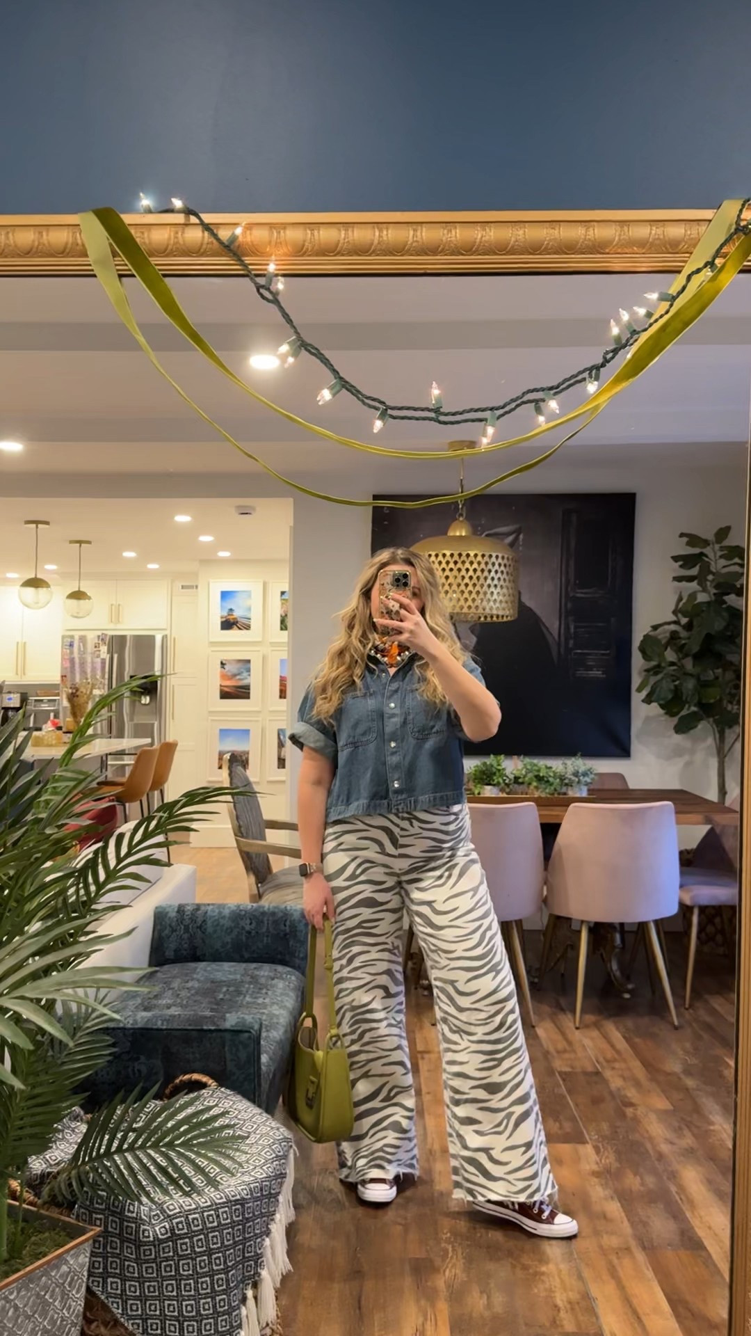 Spring outfits 2026. Obsessed with this funky Spring outfit! Madewell boxy airy denim short sleeve button up wearing a large for an oversized fit (currently on sale 25% off). Daze Denim Far Out High Waist Wide Leg Jeans in Zebra wearing a 31 but probably could've gotten a 30. 

 #LTKFestival #LTKootd #LTKMidsize