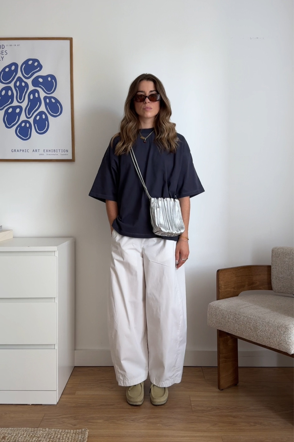 Casual outfit, oversized navy tshirt, cos barrel leg trousers, silver scalloped bag, high street style, Clark’s wallabee shoes 

#LTKeurope #LTKuk #LTKstyletip