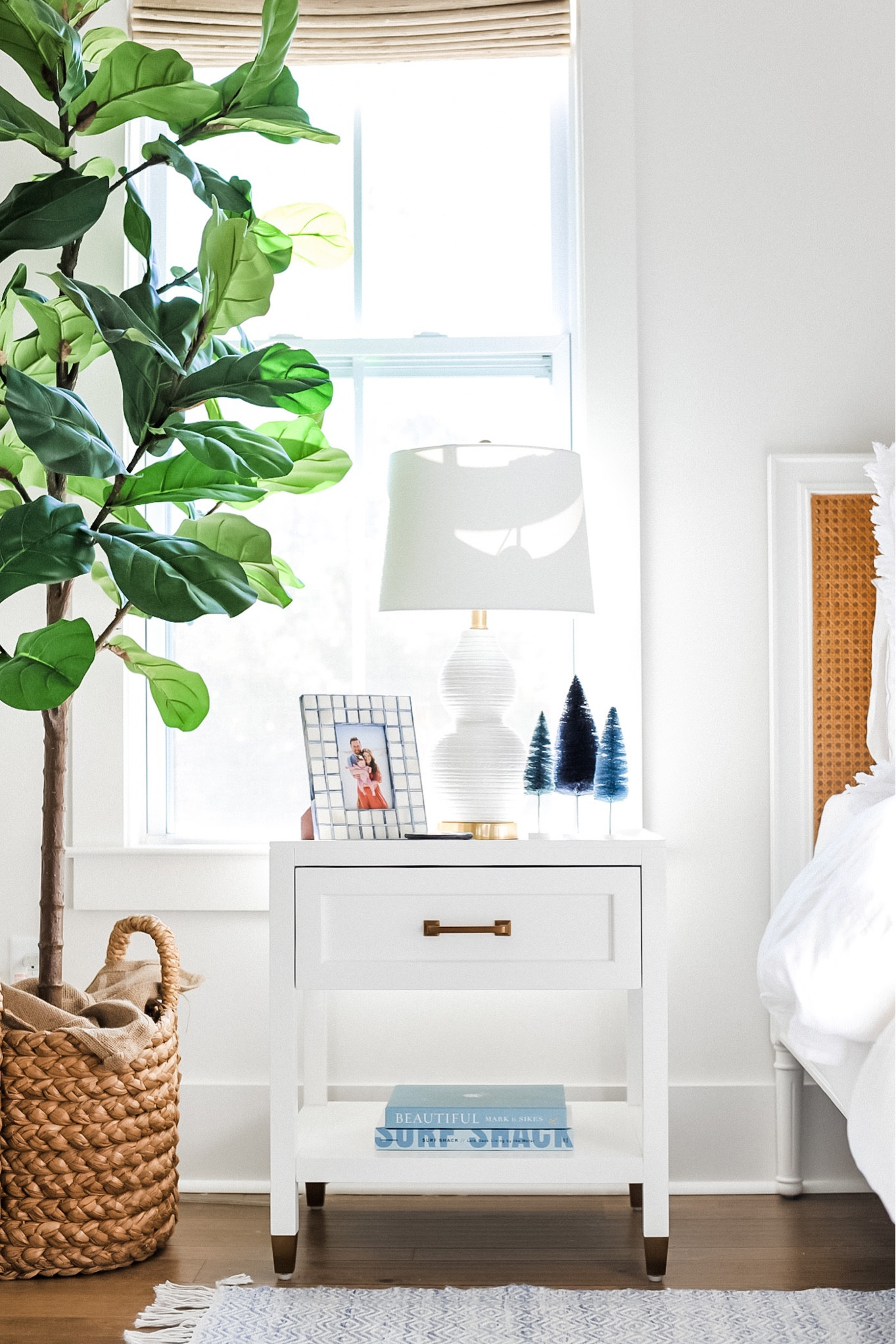 Blue bottle brush trees 20% off now! Also nightstand is 25% off with code gratitude! 

Coastal Christmas, serena and lily nightstand, fiddle leaf fig, coastal picture frame, coastal books 

#LTKhome #LTKsalealert #LTKHoliday