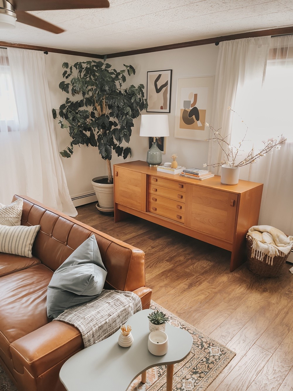 Throwback to the retro-inspired décor in our family room at the old house! Get the look with these furniture pieces, art prints, plants, lamps, and more ⭐️

#LTKHome #LTKFindsUnder100 #LTKFindsUnder50