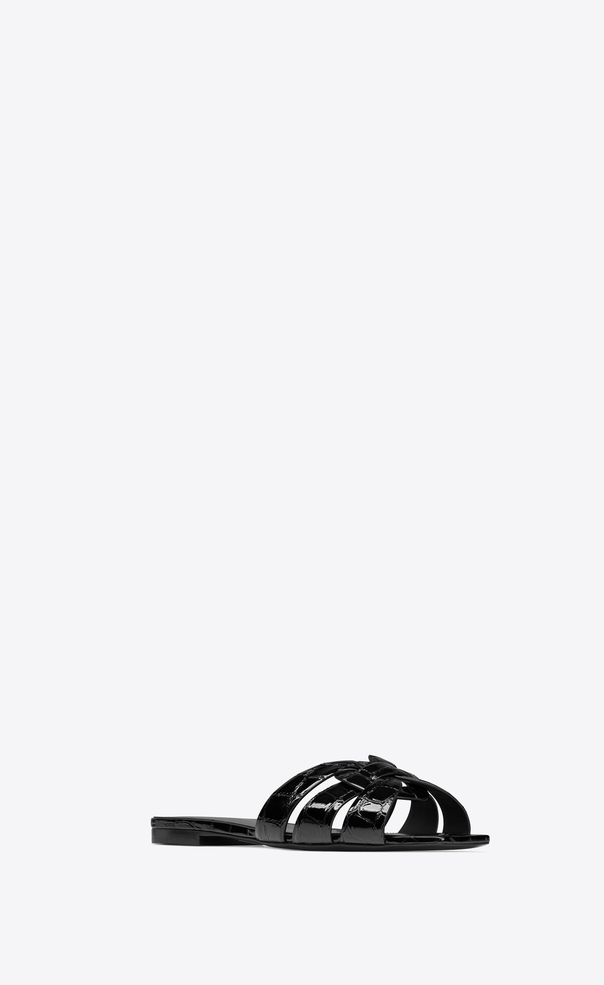 flat mules with a square peep toe and intertwining straps. | Saint Laurent Inc. (Global)