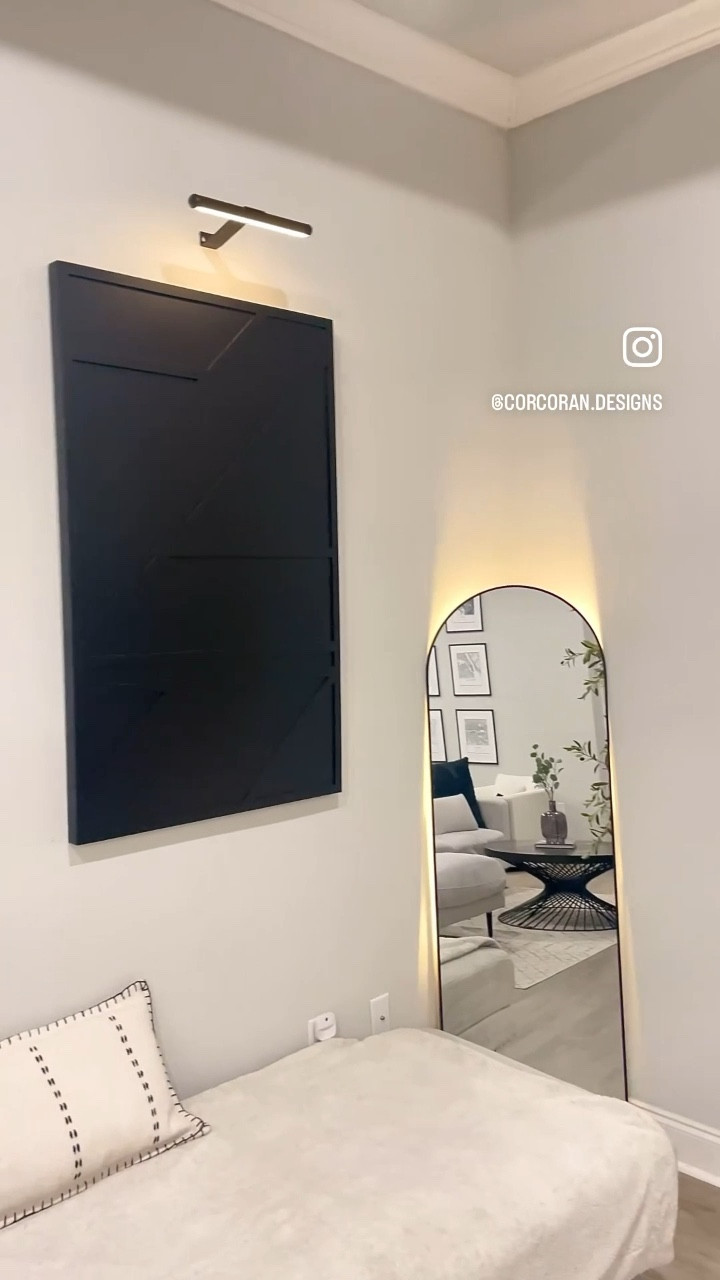 added some accent lighting to my living room✨ 

I’ve had my eyes on these gallery art lights for awhile, and I’m so happy with how it turned out! 🖤

the best thing is, it took me less than 5 mins to put it up, andddd it came with a remote! 🙌🏼

then I added some warm white lights behind my arch mirror! ✨ I love the way it looks, especially at night!

✨Follow @corcoran.designs for modern, home decor style tips🤍

✨Like and save this post for modern, minimalist home design inspo!

Modern home 
Accent lighting
Mirror lights
Gallery wall lights
Artwork lights 
Home decor finds 
 
#Accentlighting #accentlights #Mirrorlights #Gallerwall #lights #Artworklights #homedecorfinds 

Do you use accent lighting in your home??👇🏼👇🏼

#LTKhome #LTKsalealert #LTKVideo
