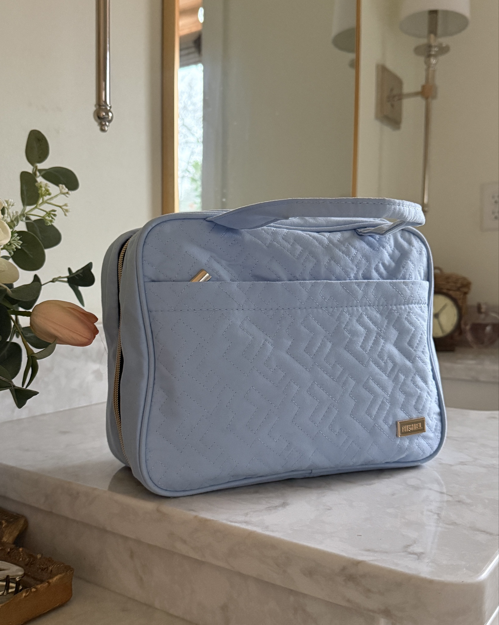 Such a great travel toiletry bag! It has tons of storage for toiletries and brushes, plus a hook for hanging which makes it so convenient for travel. I also love this soft blue color, but it comes in several other options.

#LTKTravel #LTKHome