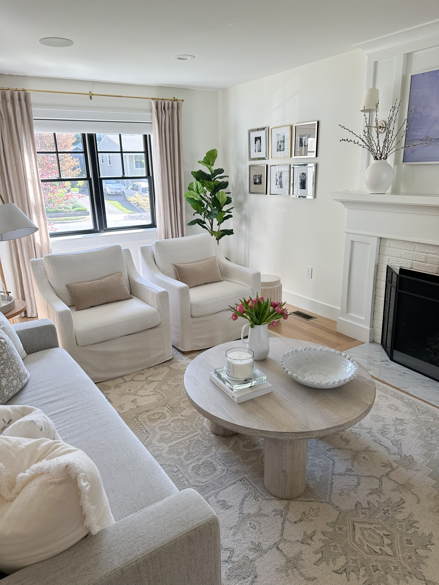 Living room design, neutral area rug, round light wood coffee table, coffee table styling, home decor, white accent chair, throw pillow, Amazon find, Amazon home 

#LTKhome #LTKstyletip #LTKFind