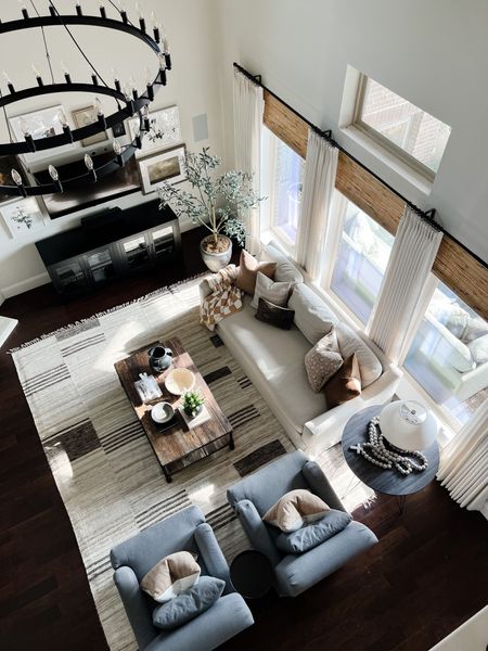 My neutral living room with light slipcover sofa, gray chairs, stripe rug, linen drapes, and bamboo shades



#LTKhome