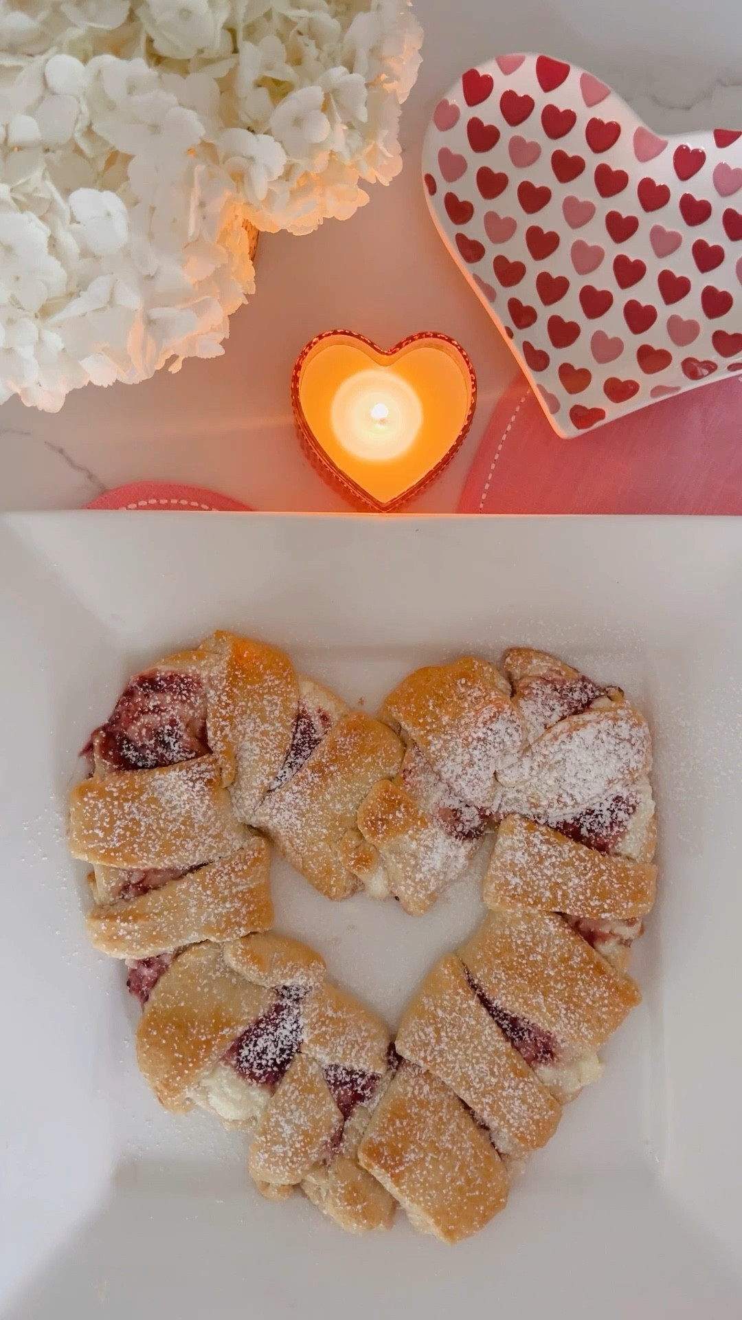 ❤️🤍 Easy Heart Pastry 🤍❤️
.

came up with the genius idea to shape candy cane pastries into a heart shape a few years ago. I'm obsessed with how it turned out and it's a total crowd pleaser!
Recipe: Two cans of crescent rolls, Cream cheese frosting, Favorite fruits preserve/jelly. Place the dough as shown above, Layer with the frosting and preserve, Twist the ends over as shown above Layer, Do a quick egg wash over.
Bake on 350° for about 18 minutes then top with powdered sugar!
This is such a fun way to celebrate Valentine's Day! 

#LTKSeasonal #LTKHome #LTKU