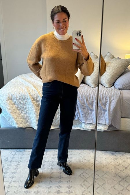 A dressy casual winter work outfit! A Madewell mockneck shell (runs small, I’m wearing a L) adds interest to a chunky Tory Burch sweater (runs big, I’m wearing a S). I front tucked it into Madewell wide leg jeans (TTS, size 29 tall) with Tory Burch Chelsea boots (TTS, size 11)  

#LTKworkwear #LTKSeasonal #LTKmidsize