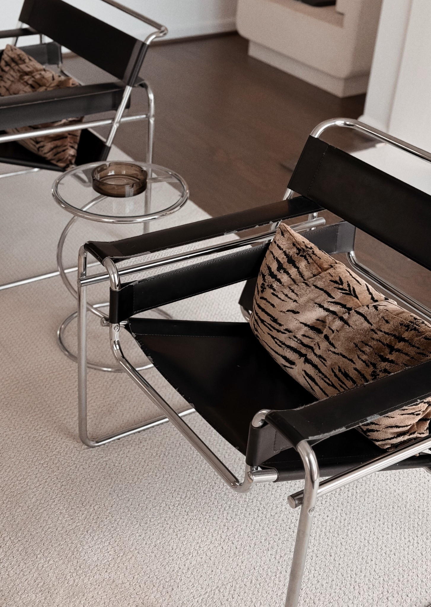Living room details. 

Wassily chair lookslime, Animalia Velour Velvet Lumbar Pillows , Chrome and glass spiral coil spring occasional side end table attributed to Leon Rosen for Pace collection , vintage home decor 

#LTKHome