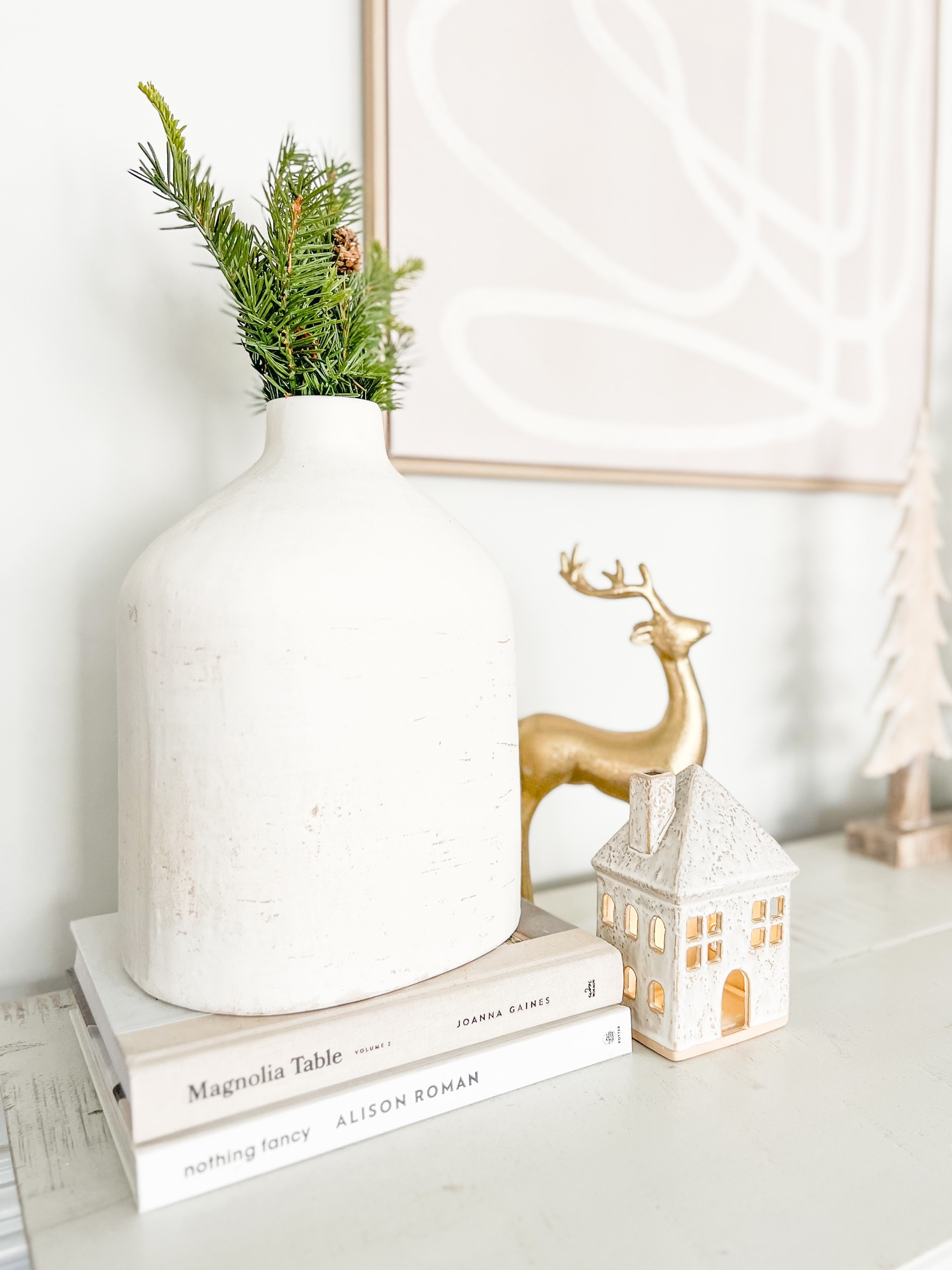 Christmas home decor. Christmas table top decor. Coffee table books. Christmas greenery. Gold decorative deer. 

#LTKhome #LTKHoliday #LTKSeasonal