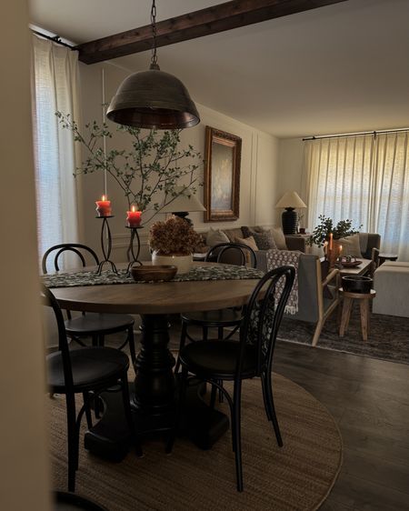 Dining room, bronze pendant, black dining chairs, jute rug, curtains

#LTKhome
