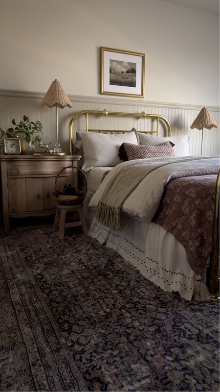 Natural linen sheets and duvet cover, cloudpile rug, wicker lamp, mini stool, bed skirt, gold brass headboard 

#LTKhome