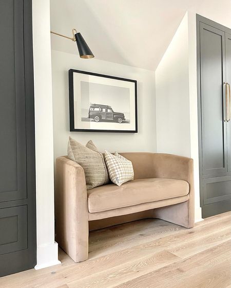 Our upstairs hallway at the cottage!  We added lots of storage here a TV area with as much seating as we could squeeze in and a piece of beech art!

#LTKhome