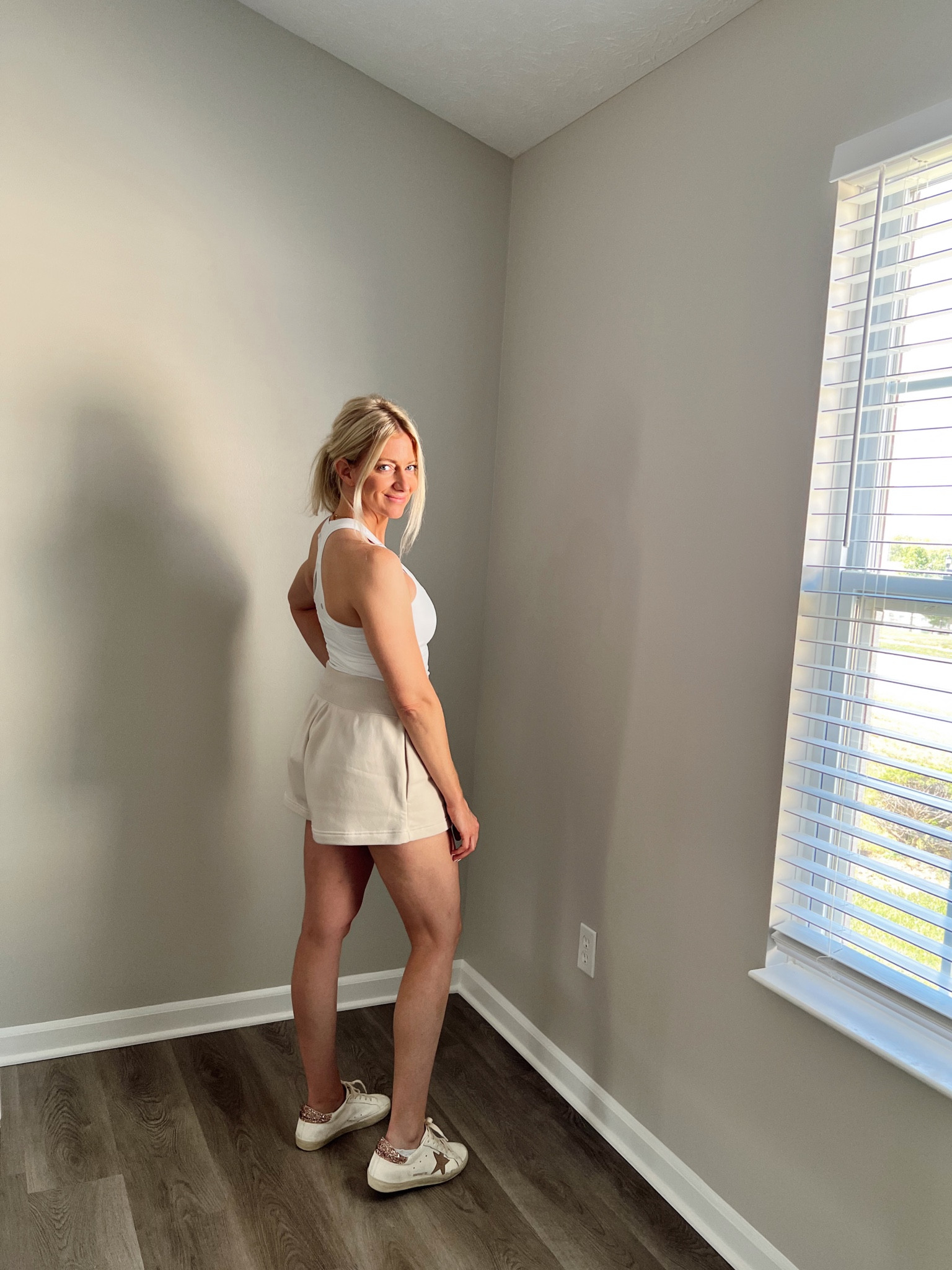 I love everything about these sweat shorts. They flare out and hold their shape so they look better than other sweat shorts. The waist band is flattering too and has a drawstring. They’re high waisted as well, but a perfect length. 😍 I love them with a tight tank or a shirt tucked in the front. 

Summer to fall look
Lululemon nulu
Nike 
Tank top
Golden Goose sneakers 

#LTKstyletip #LTKfitness #LTKfindsunder100