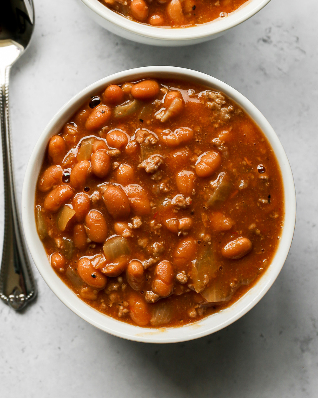 Everything you need to make these Gluten Free Baked Beans with Ground Beef is right here. The Our Place Perfect Pot is what I use for both browning the beef and baking everything together, so cleanup is so easy. The meat chopper makes breaking up the ground beef effortless, and the bamboo wooden spoons and silicone serving spoon are what I reach for constantly while cooking and serving. The Henckels Santoku knife is perfect for dicing the onion and the cutting board set keeps everything organized while you prep. Tap to shop everything I used to make this recipe! 

 #LTKdayinmylife #LTKfoodie #LTKHome