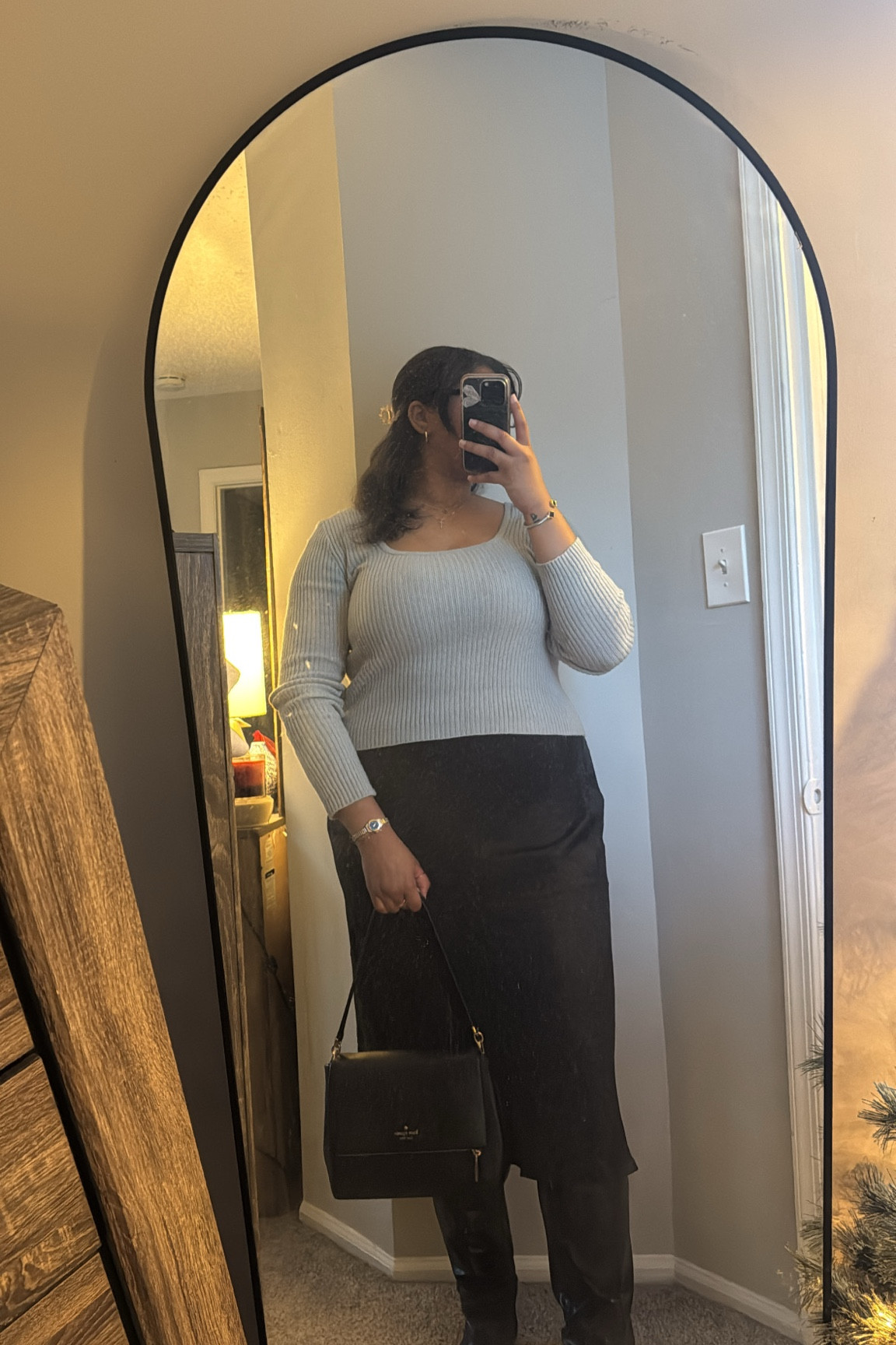 Effortlessly versatile—this look transitions seamlessly from office chic to downtown vibes. The sleek knit top and satin skirt combo paired with knee-high boots and a classic bag is the perfect mix of polished and edgy. Where would you wear this? ✨ #LTKStyle #DeskToDinner #ModernClassic

#LTKWorkwear #LTKFindsUnder50 #LTKItBag