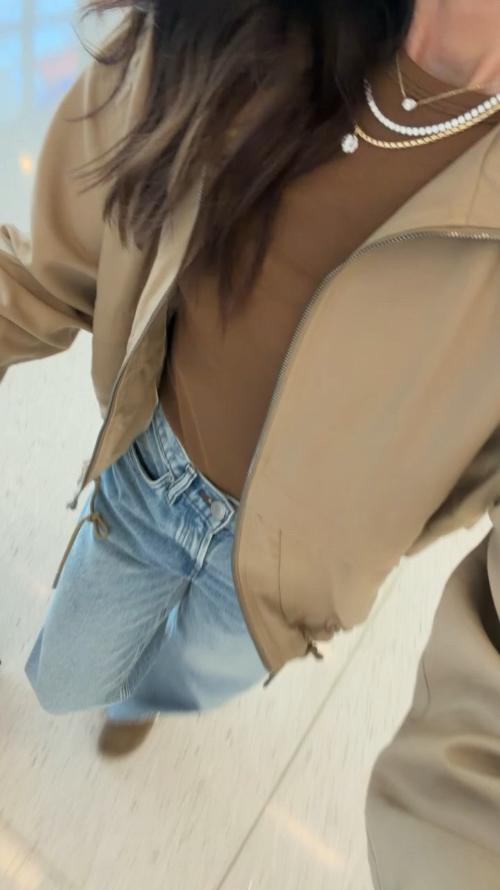 My fall airport outfit. I love pairing a lightweight neutral jacket with a simple brown top and relaxed denim for travel. Comfortable enough for a long flight, with layers that are easy to take on and off when the temperature changes. Finished with my everyday jewelry and suede shoes.
fall airport outfit, travel outfit, airport style, neutral jacket, brown top, wide leg jeans, comfortable travel outfit, fall travel style, casual fall outfit, airport fashion, travel essentials, annabrstyle