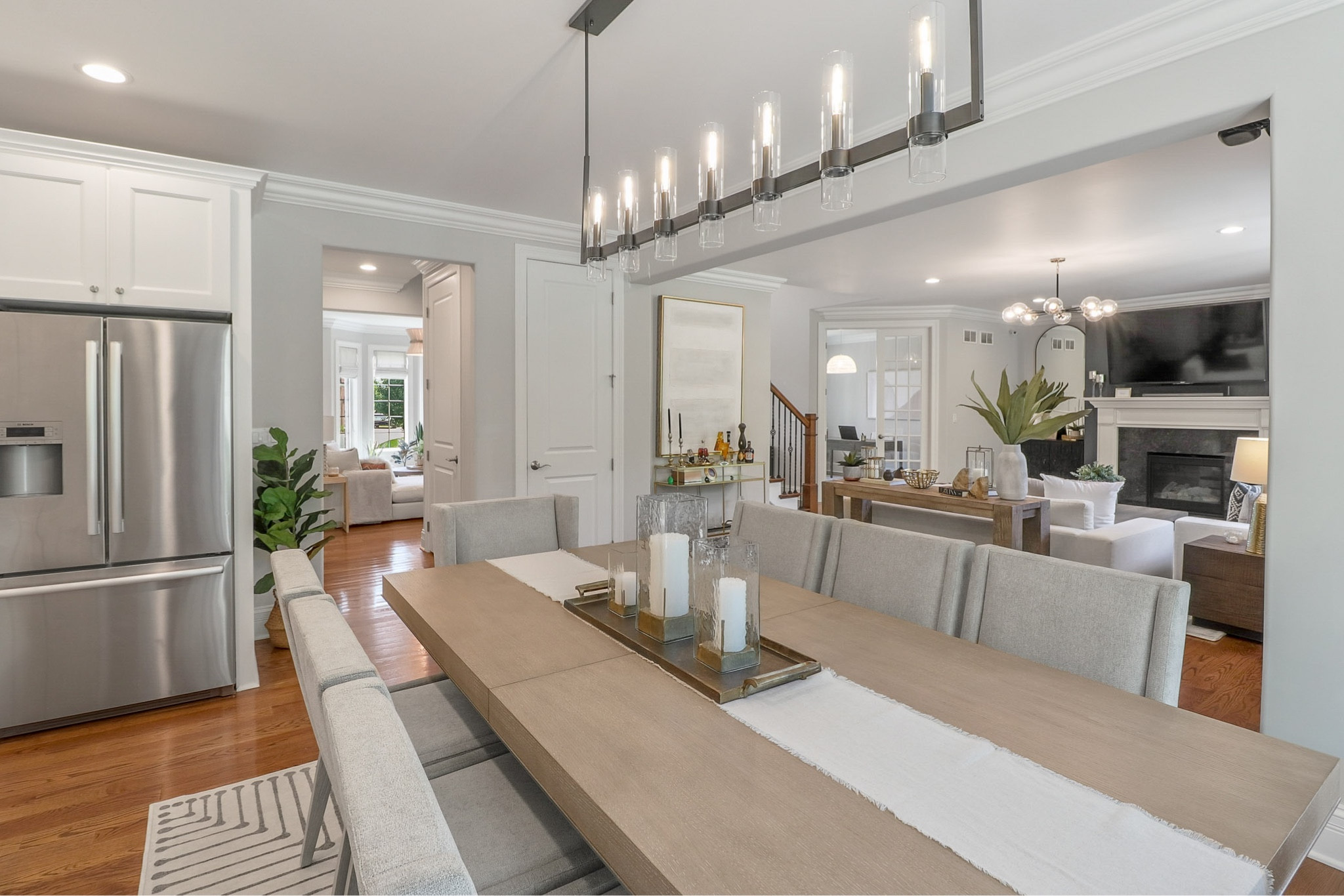 Modern dining room design featuring linear pendant, abstract rug, and comfortable seating.

#LTKstyletip #LTKhome