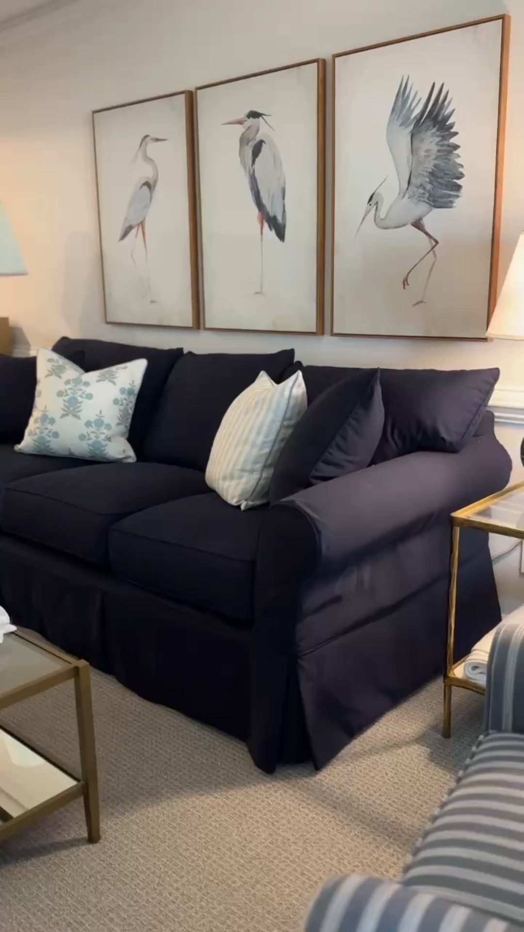 Ready for guests at our Airbnb! Classic living room, coastal living room, Grandmillennial decor, blue striped swivel chair, art prints, pillows, kid friendly couch

#LTKHome