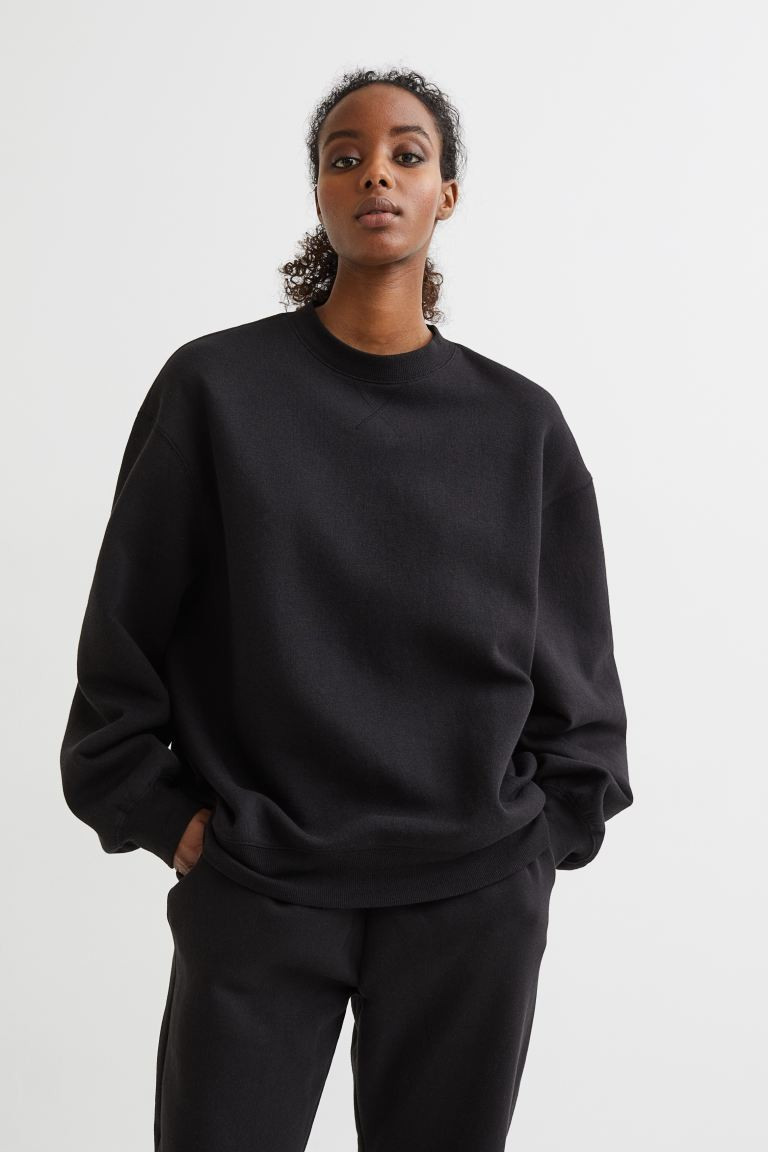 Conscious choice  Oversized sweatshirt in cotton-blend fabric with soft, brushed inside. Dropped ... | H&M (US + CA)