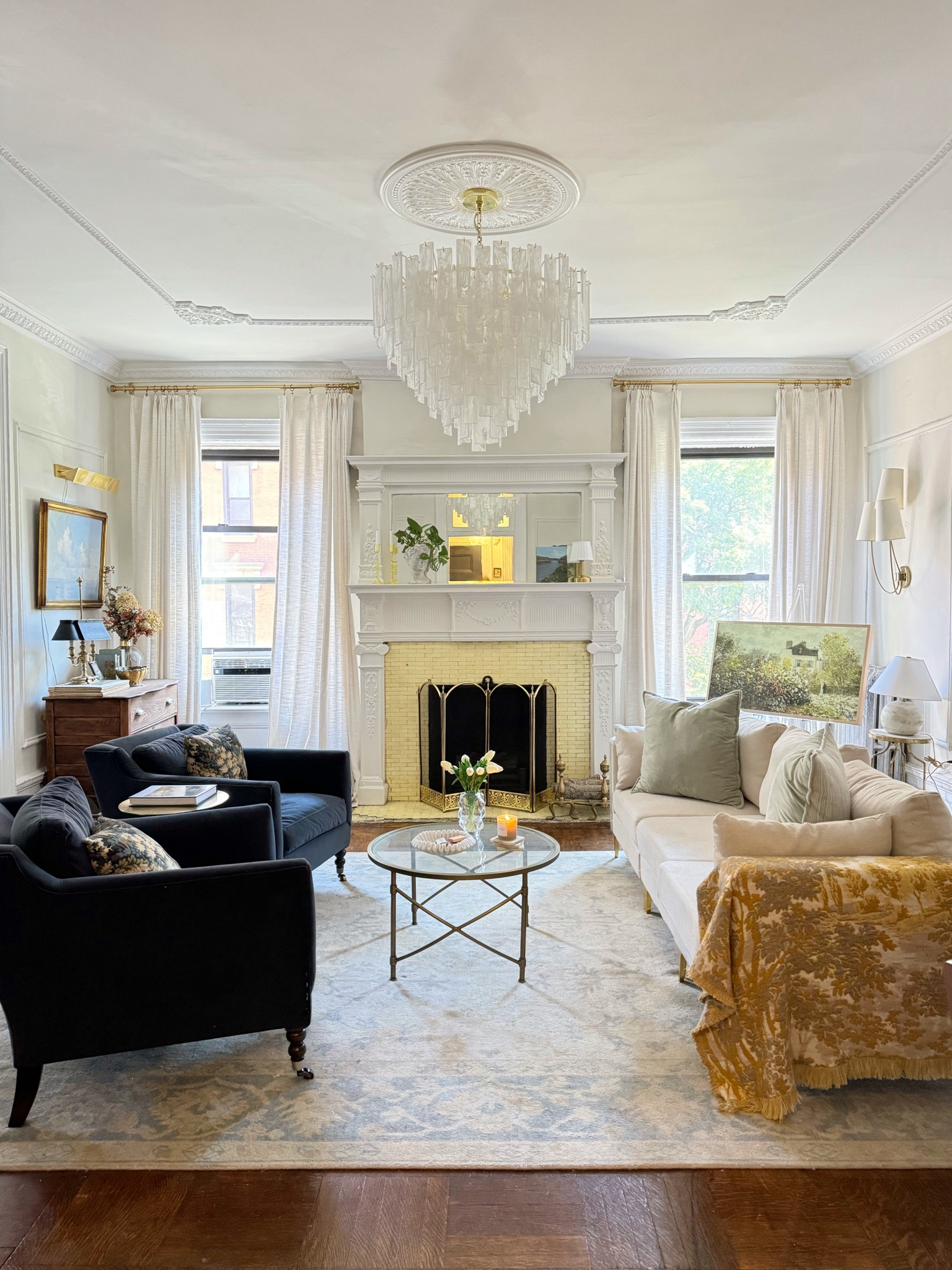 Living room- throw pillow, sofa, coffee table, velvet chairs, tapestry pillow, linen curtains, chandelier, picture light 

#LTKHome