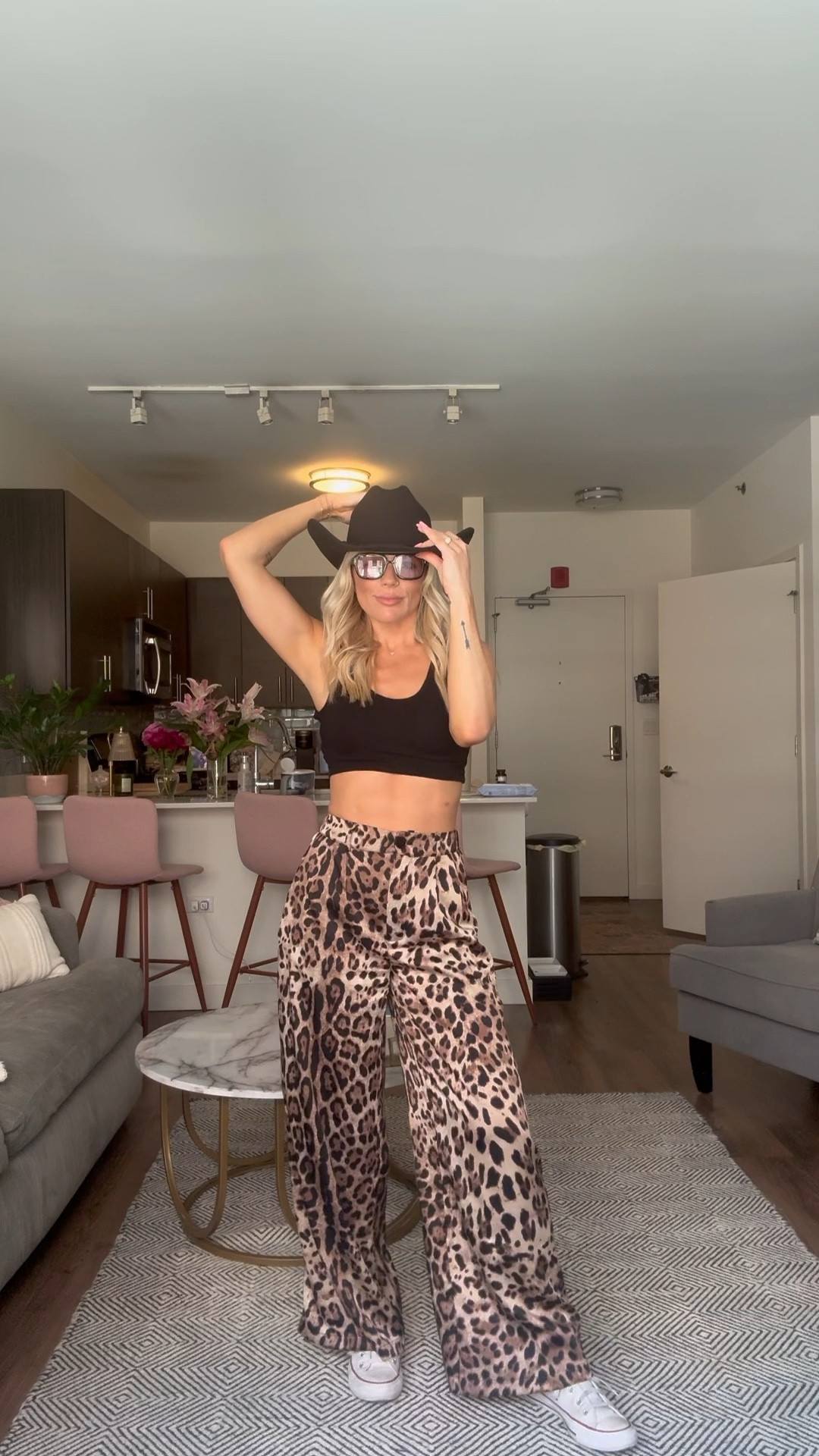 Leopard pants, cheetah pants, sports bra and cowboy hat 