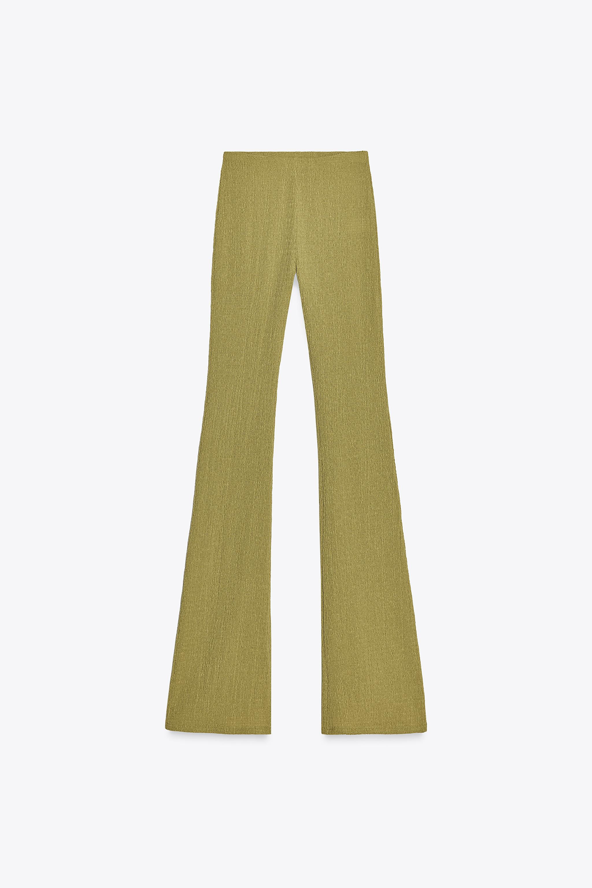 Mid-waist trousers with an elasticated inner waistband. Textured fabric. Flared hems. | Zara UK