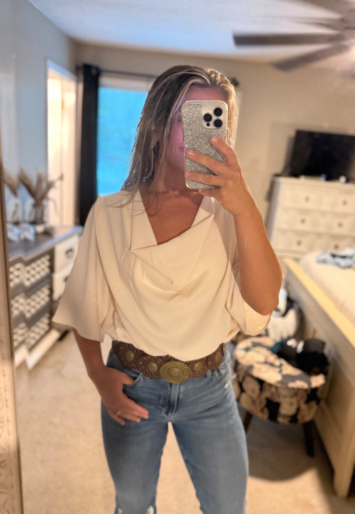 Loving this flowy top along with the thick western belt and flare jeans to tie it all together. 

#LTKStyleTip #LTKFindsUnder50 #LTKMidsize