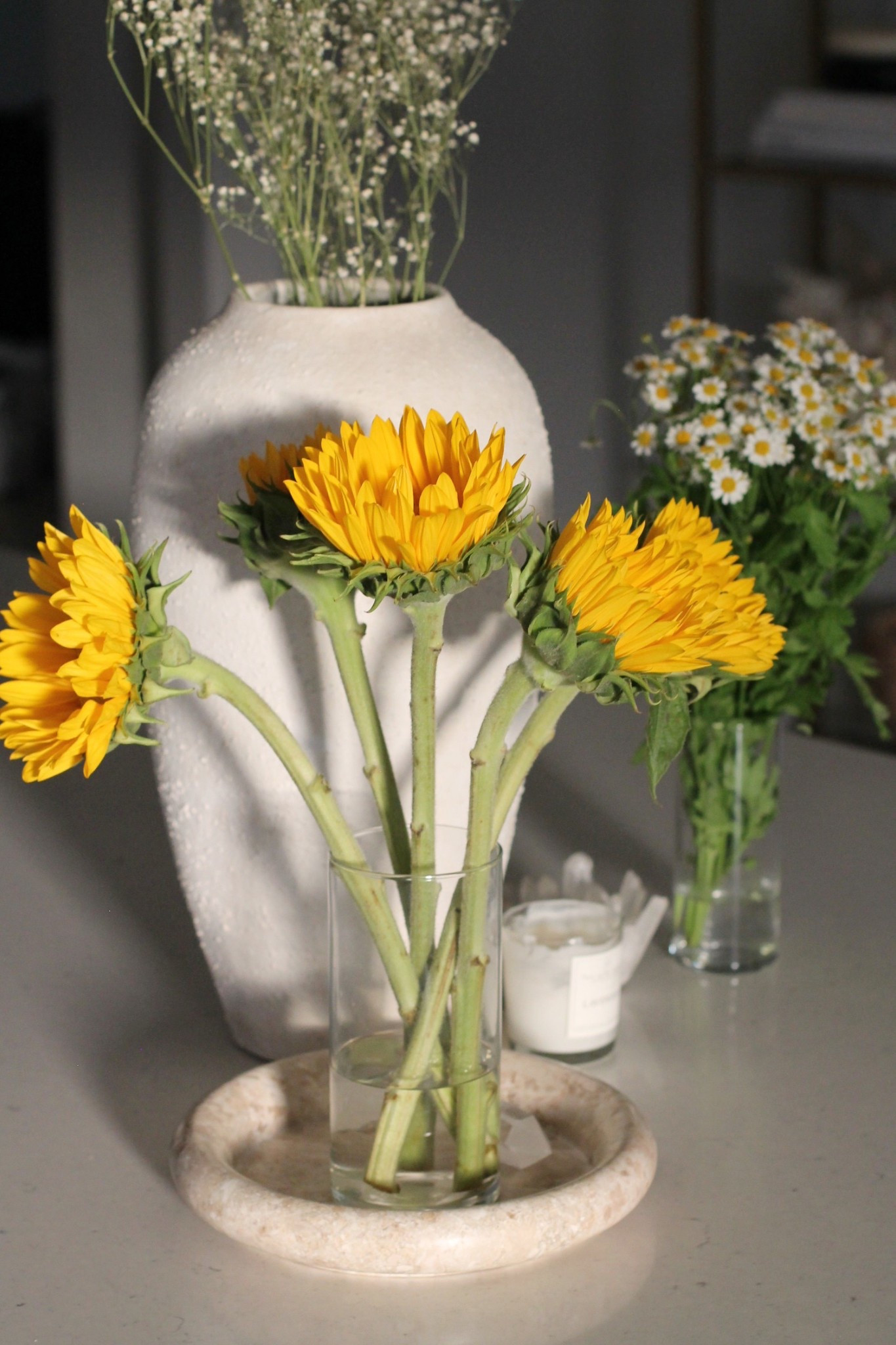 Spring kitchen island decorating
White cb2 vase
Sunflowers 
Quartz candle holder
Travertine tray
White kitchen 
Organic modern home decor 


#LTKSpringSale #LTKHome #LTKSeasonal