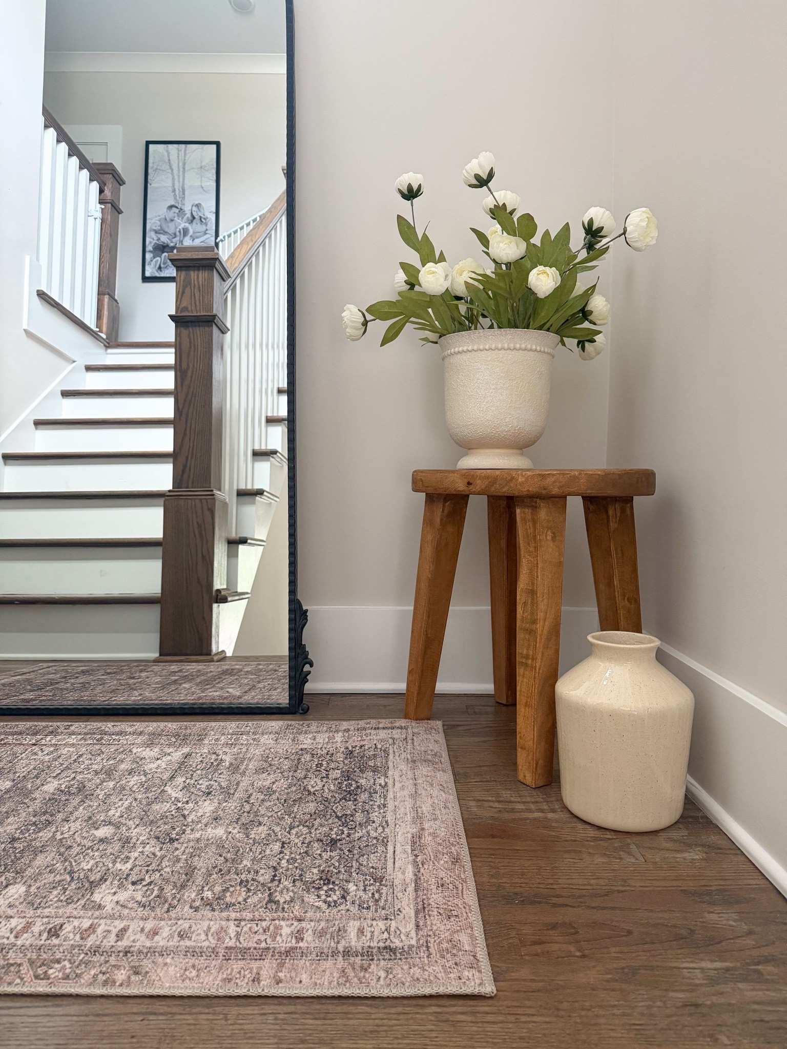 A stairwell, corner or landing can be such an awkward space to decorate! I love adding in faux florals, vases, rugs and side tables to cozy up a space!

#LTKmomlife #LTKHome