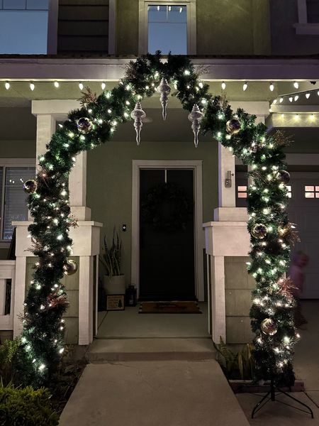 Garland arch for your outdoor porch decorations! Under $100 for  the arch! Perfect outdoor Christmas decor! 

#LTKHoliday #LTKhome #LTKSeasonal